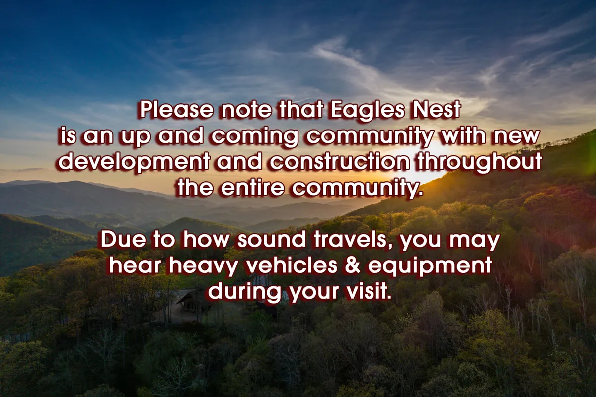 An expansive view of the Eagles Nest community set against a breathtaking mountain range at sunset, with lush greenery in the foreground. The image evokes tranquility, natural beauty, and the sense of a growing, inviting community surrounded by nature.